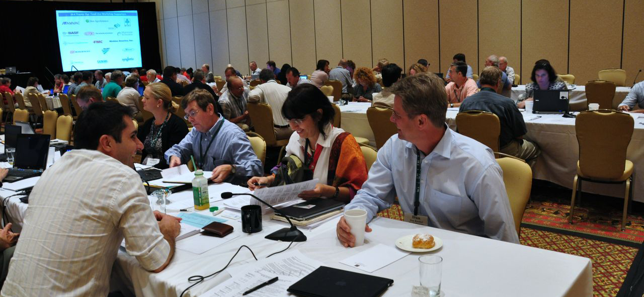 People sitting at tables at a conference