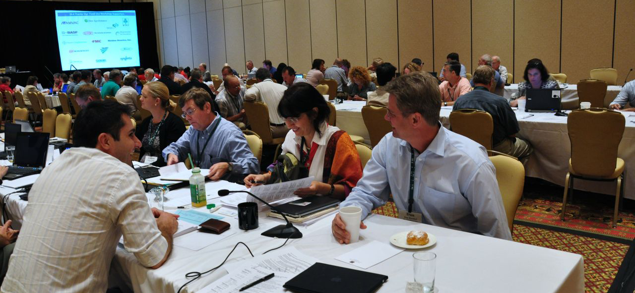 FUW5 cropped People sitting at tables at a conference